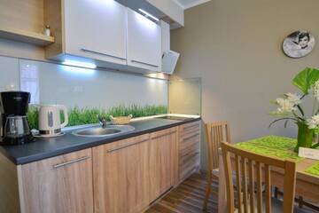 Фото номера One-Bedroom Apartment with Free Parking - 22 Апартаменты Apartamenty na Wyspie - Villa Pegaz г. Свиноуйсьце 9