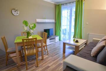 Фото номера One-Bedroom Apartment with Free Parking - 22 Апартаменты Apartamenty na Wyspie - Villa Pegaz г. Свиноуйсьце 2