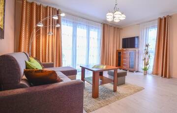 Фото номера One-Bedroom Apartment with Parking Place Апартаменты Apartamenty Bryza - Ulanska г. Свиноуйсьце 16
