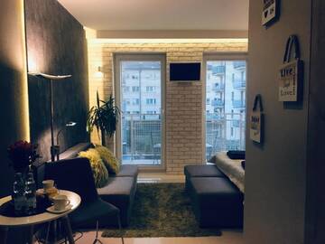 Фото номера Апартаменты с балконом Апартаменты 4UApart-Apartment studio Mohito г. Свиноуйсьце 11