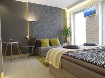 Фото номера Апартаменты с балконом Апартаменты 4UApart-Apartment studio Mohito г. Свиноуйсьце 35