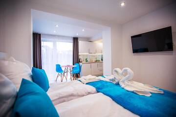 Фото номера Стандартный трехместный номер-студио Апарт-отели Adonis Apartments г. Свиноуйсьце 5