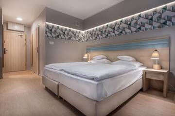 Фото номера Стандартные апартаменты Апарт-отели Apartamenty Resort ,,Cesarskie Ogrody' г. Свиноуйсьце 11